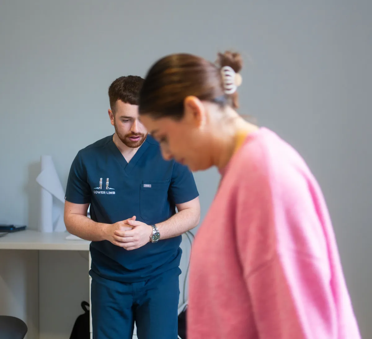 Podiatrist observing patient gait analysis at Lower Limb Clinic