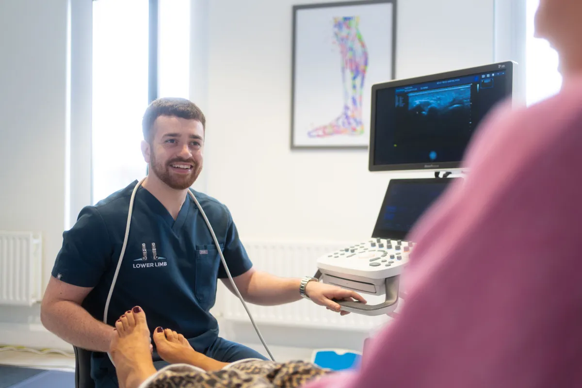 Paul McMullan performing a diagnostic ultrasound of the plantar fascia at Lower Limb Clinic on Lisburn Road